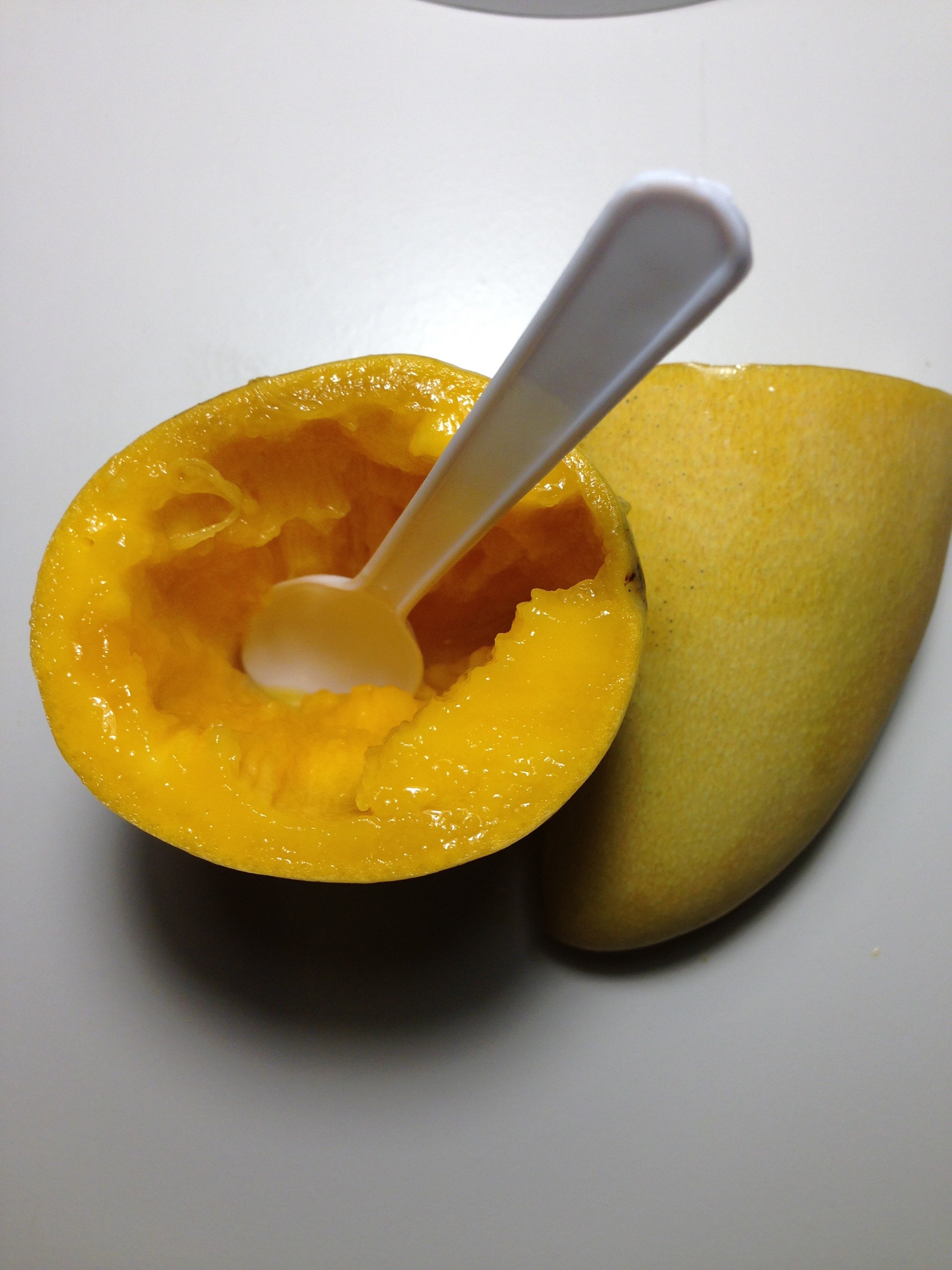 Left a mango out overnight, the half with a spoon became rotten much faster  than the other : r/mildlyinteresting